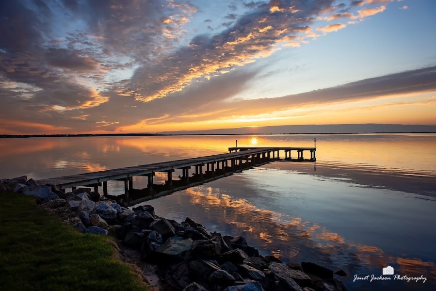 Award-winning sunset pier photograph by Janet Jackson